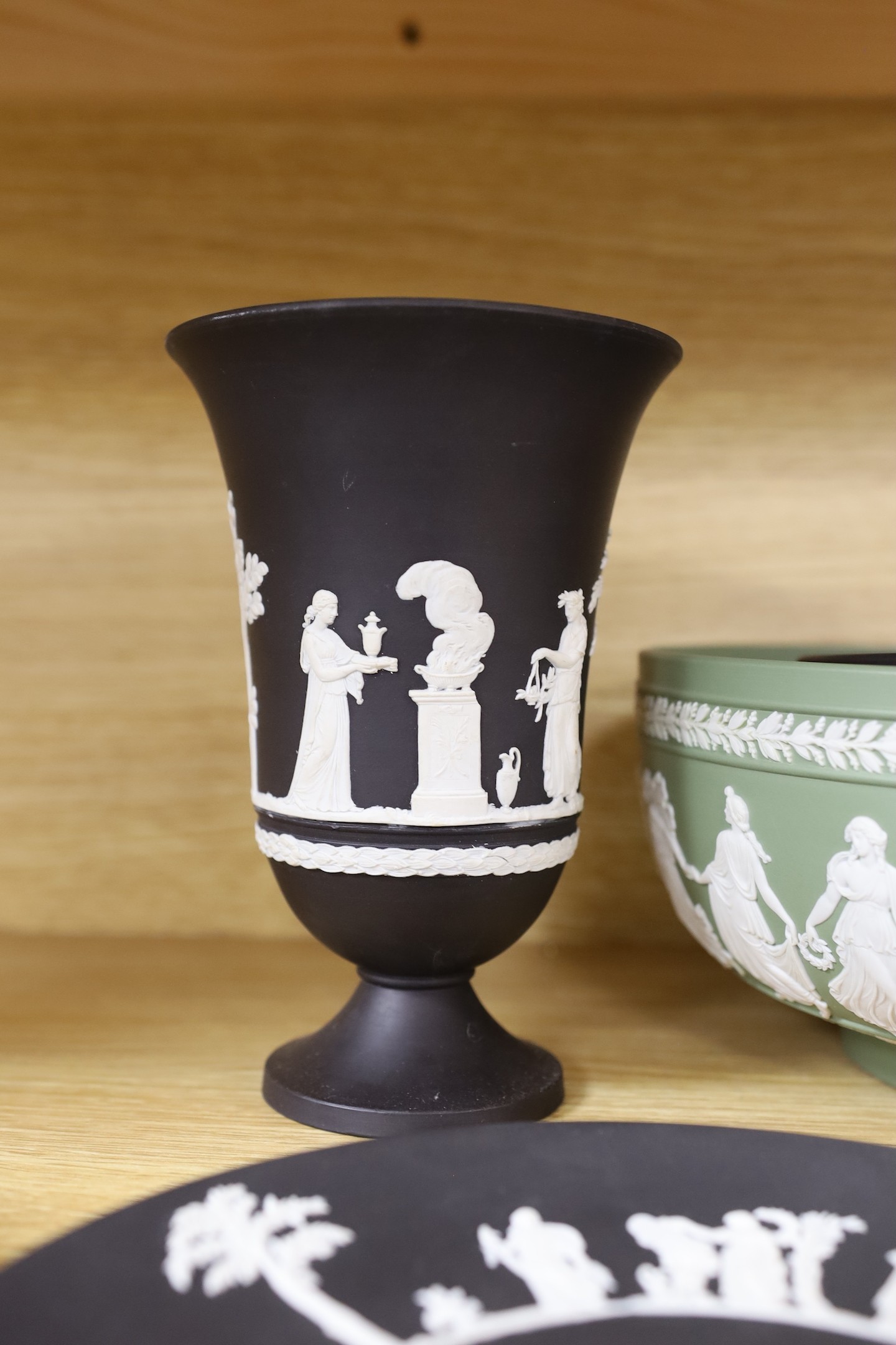 A Wedgwood black basalt pair vases, bowls, 3 plates and green bowl and glass bowl, vase 18 cms high